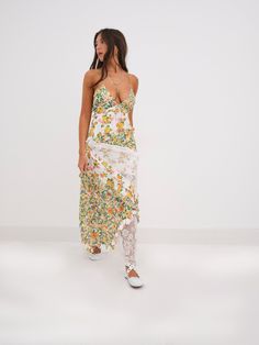 Dreamy asymmetrical patchwork garden and carnation print maxi dress featuring a plunging neckline, fresh white floral lace paneling, and feminine pin-tucked and ruffle detailing throughout. Partially lined, delicate shoulder ties. Patchwork Sundress, Spring Formal, Lemon Dress, For Love & Lemons, Maxi Dress Green, Vintage Glamour, Dress Green, Types Of Skirts, Unique Dresses