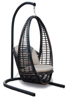 an outdoor hanging chair with cushion and stand