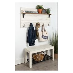 a white bench sitting next to a wooden shelf