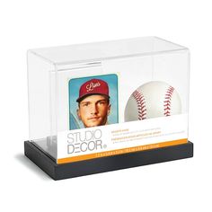 a display case with a baseball inside of it