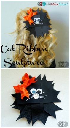 the cat ribbon sculpture is made out of black paper and has orange bows on it