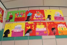 several children's birthday cards are displayed on the wall in front of a tiled floor