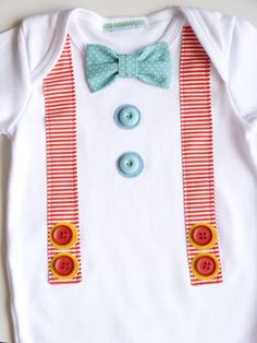 a white shirt with red and blue striped suspenders and a bow tie on it