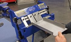 a person is using a machine to cut something