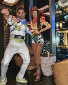 a man and woman dressed up in costumes