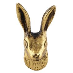 a gold rabbit head on a white background