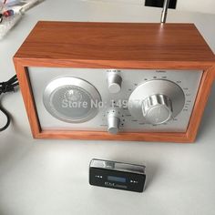 an old fashioned radio sitting on top of a table