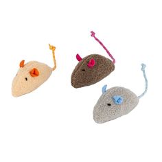 three small stuffed mice are shown on a white background