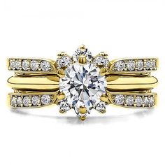 a yellow gold engagement ring with an oval cut diamond surrounded by two rows of diamonds