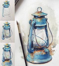 the blue lantern is next to a brush and some watercolor pencils on paper