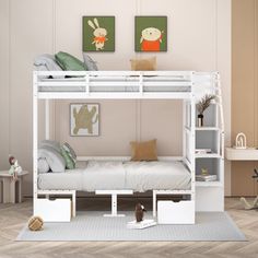 a white bunk bed sitting on top of a wooden floor