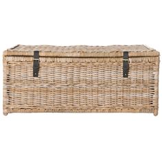 an empty wicker chest with leather straps on the top and bottom, against a white background