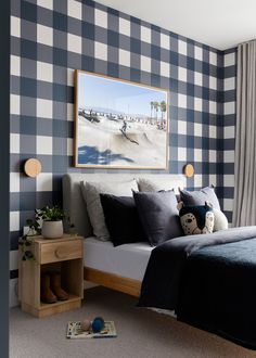 a bedroom with blue and white checkered walls