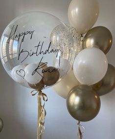 a bunch of balloons that say happy birthday kora and have some writing on them