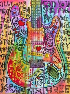 a colorful guitar with lots of writing on it