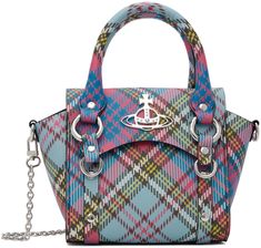 Coated canvas messenger bag in tones of pink and blue. Studded detailing and tartan pattern printed throughout. · Rolled carry handles · Detachable chain link shoulder strap · D-ring and logo hardware at face · Bumper studs at base · Foldover flap with magnetic press-stud closure · Card slot at interior · Unlined · H6 x W7 x D4 in Supplier color: MacAndy tartan 1950s Pin Up Girl, Vivienne Westwood Purse, Vivienne Westwood Shop, Best Online Stores, Punk Inspiration, The Vivienne, Fisherman Sweater