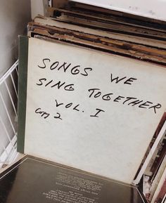 there is a sign that says songs we sing together, vol i