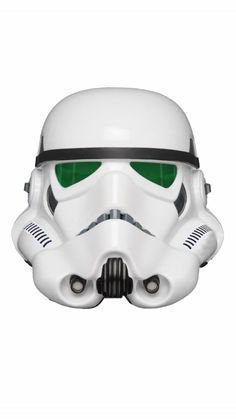 a star wars helmet with green eyes on the front and side of it, in white