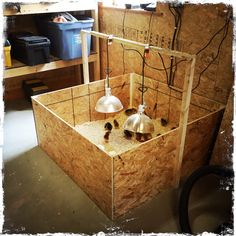 two lamps are sitting in the middle of a room with plywood walls and flooring