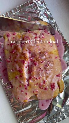 raspberry lemon loaf with icing on aluminum foil
