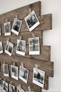 a wooden board with pictures hanging on it