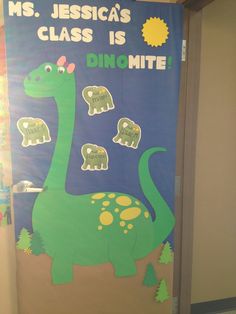 a door decorated with an image of a dinosaur and the words ms jesus's class is dinomite