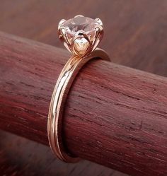 a close up of a ring on a wooden surface