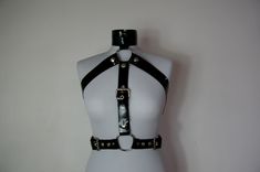 Strong latex harness with removable middle part. The collar is 5 cm wide. Made from triple layered latex with softened edges, approx. 2 mm thick. Glanzglück is a one-man army from Austria. This army consists of me, Puppi! Each piece is made by hand by me personally. Everything is done in literally through my fingers. All correspondence, the development of the cuts and ultimately the production of the product. The idea was never to produce large and in mass quantities, but lovingly and to look af Full Body Harness, Locking Collar, Chain Harness, Me Personally, Body Harness, Leather Harness, Middle Parts, Middle Part, White Button Down