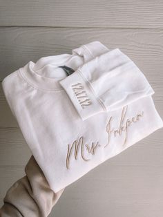 a white t - shirt with the word mrs hope on it