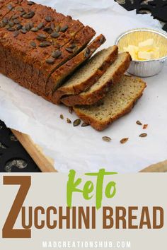 a loaf of zucchini bread with butter and seeds on top, next to a bowl of sunflowers