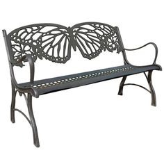 a metal bench with a butterfly design on it's back and armrests