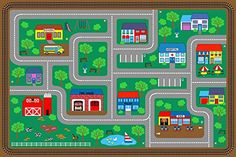 a children's play area with a road map and cars on the street,