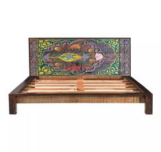 a wooden bed frame with an intricately painted design on the top and bottom panel