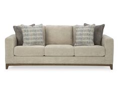 an image of a couch with pillows on it's back and the seat upholstered