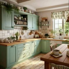 a kitchen filled with lots of green cupboards and counter top space next to a wooden table