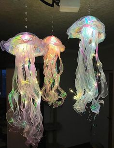 two jellyfish lights hanging from the ceiling
