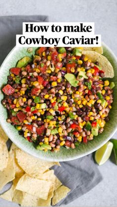 a bowl filled with black - eyed peas and corn next to tortilla chips