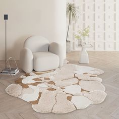 a white chair sitting on top of a hard wood floor next to a rug covered in hearts