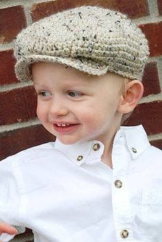 a little boy that is wearing a hat
