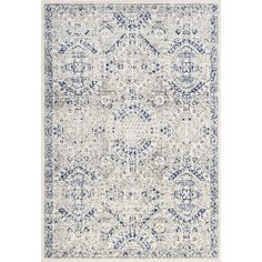 an area rug with blue and white designs on the front, along with a light gray background