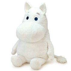 a white stuffed animal sitting on the ground