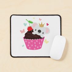 a mouse pad with a koala and cupcake on it