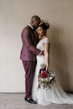 a bride and groom standing next to each other