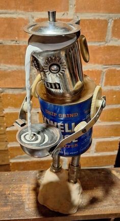 an old fashioned stove made out of tin cans