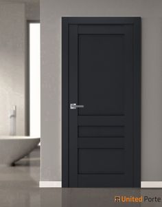 an empty bathroom with a black door and sink