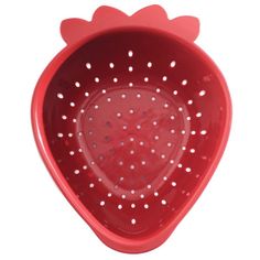 a red colander shaped like a heart with holes in the bottom and sides, on a white background