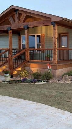 a house with a porch and stairs in the front yard