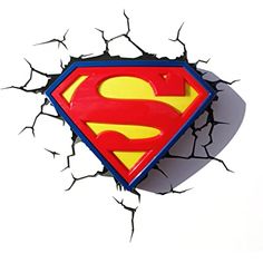 a superman logo is seen through the cracked wall