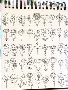 a notebook with flowers drawn on it