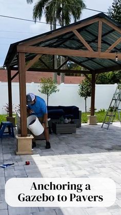 a man working on an outdoor patio area